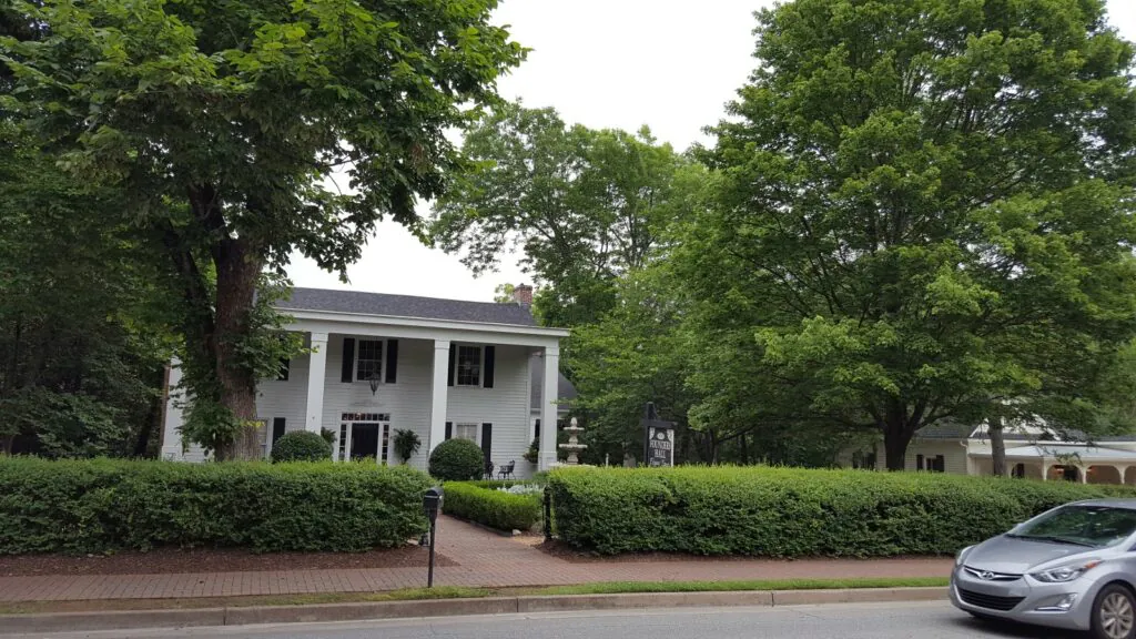 White house with bushes