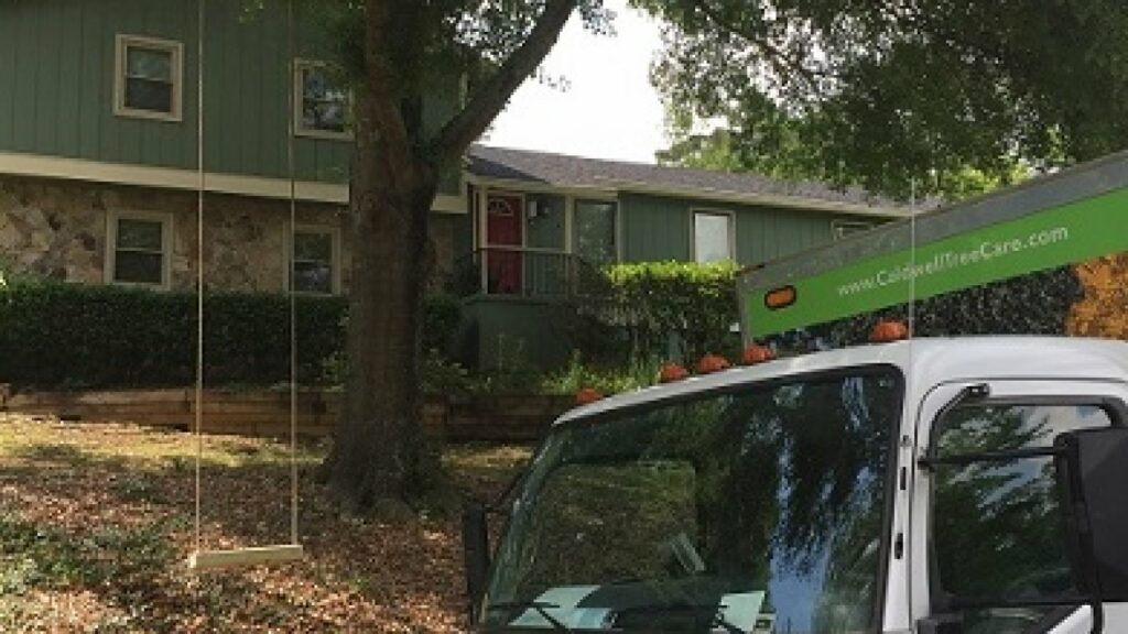 Caldwell Tree Care truck in front of home