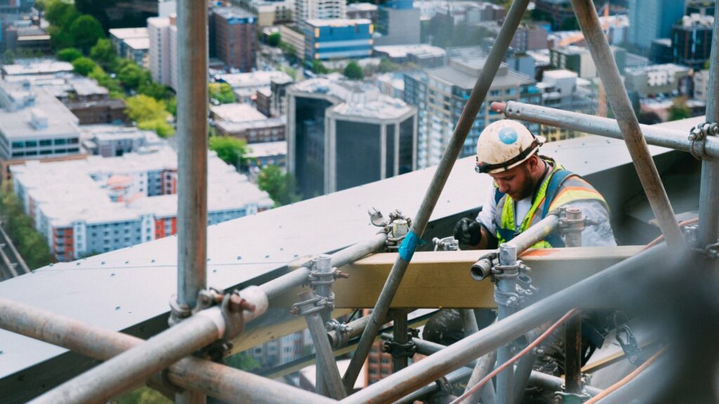 Worker on beam