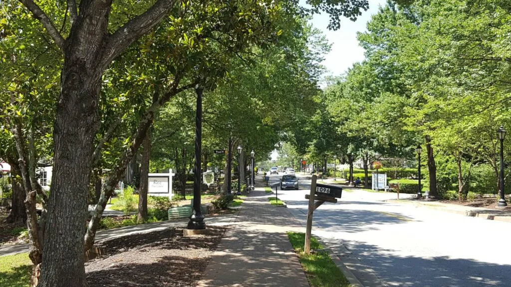 Street with cars, trees, and mailboxes